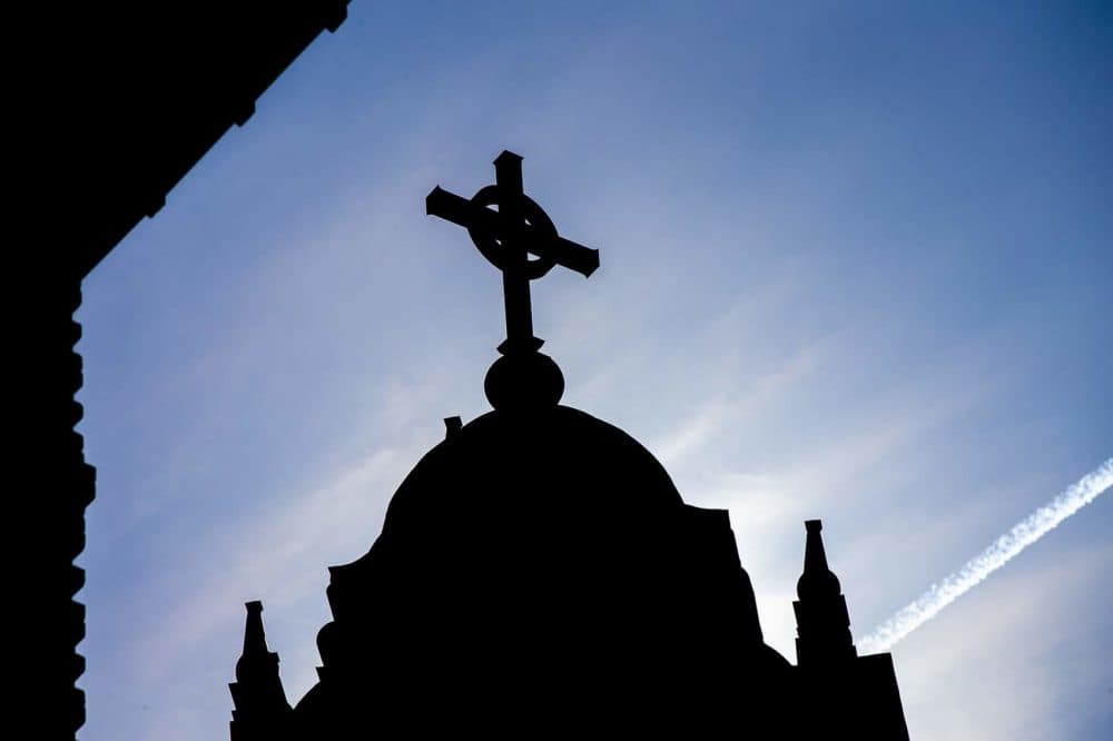 The cross atop Alumni Hall at the College of the Holy Cross in Worcester. (Jesse Costa/WBUR)