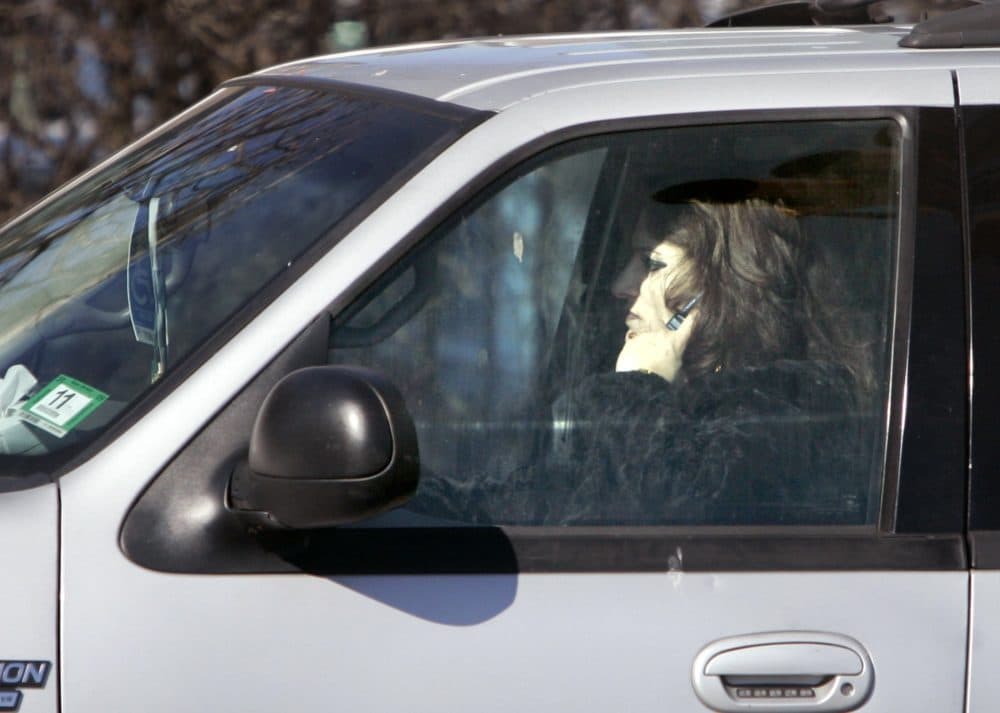 A driver talks on a cell phone while driving in Newark, N.J. in 2008. (Mike Derer/AP)
