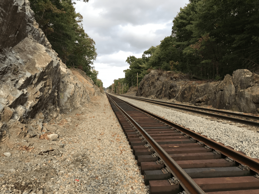 On this portion of the Franklin Line, new tracks were installed parallel to the existing track after excavating the adjacent rocks and installing a drainage system. A second phase of the project was approved Monday. (Courtesy of MBTA)