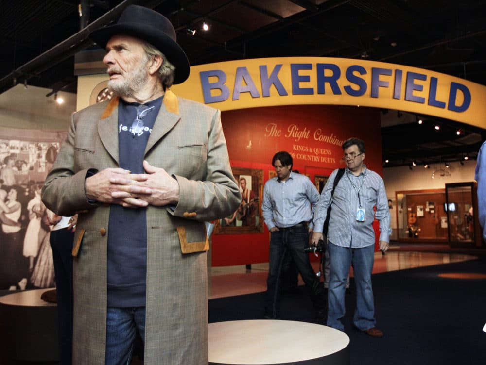 The late Merle Haggard, left, views an exhibit on the Bakersfield sound at the Country Music Hall of Fame and Museum in Nashville, Tenn. (Mark Humphrey/File/AP)
