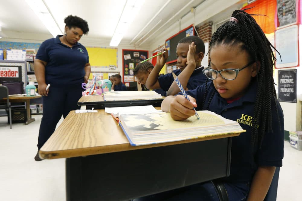 Elize'a Scott, a Key Elementary School third grade student, right, reads under the watchful eyes of teacher Crystal McKinnis, left, Thursday, April 18, 2019, in Jackson, Miss. (Rogelio V. Solis/AP)
