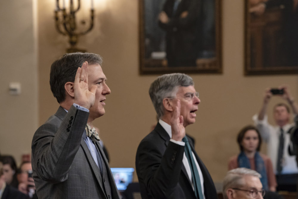 Career Foreign Service officer George Kent, left, and top U.S. diplomat in Ukraine William Taylor, right, are sworn in to testify before the House Intelligence Committee in Washington during the first public impeachment hearing. (J. Scott Applewhite/AP)