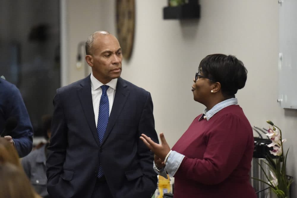 Democratic presidential candidate and former Massachusetts Gov. Deval Patrick speaks with a business owner during a campaign stop,Tuesday in Columbia, S.C. (Meg Kinnard/AP)