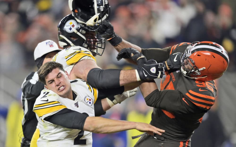 Myles Garrett hits quarterback Mason Rudolph with a helmet during an NFL football game Nov. 14, 2019. (David Richard/AP)