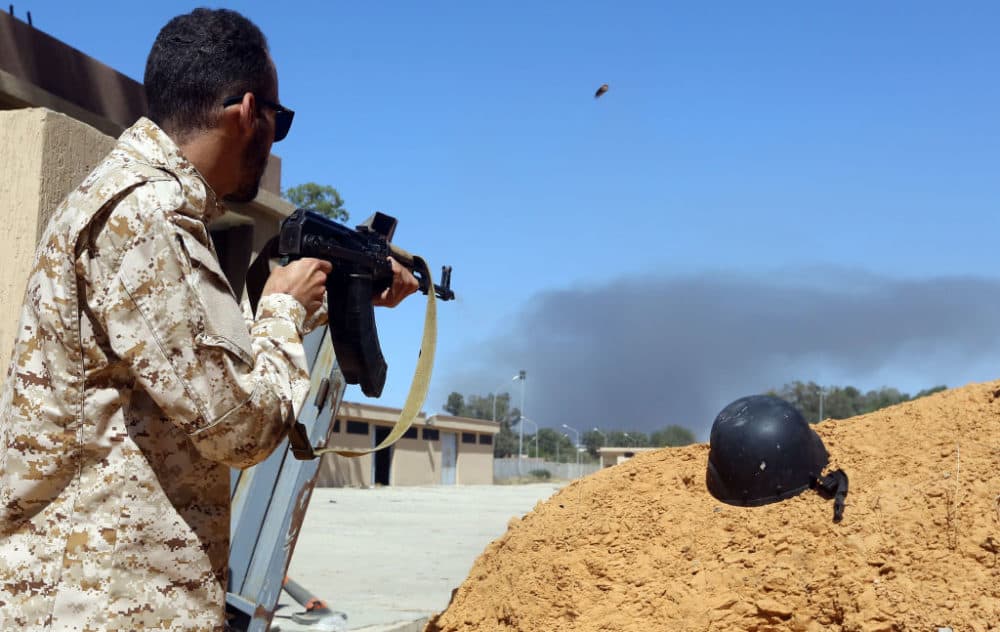 Troops loyal to military strongman Khalifa Haftar said they shot down a warplane of rival forces of Libya's unity government near Tripoli and captured its foreign &quot;mercenary&quot; pilot. (Mahmud Turkia/AFP/Getty Images