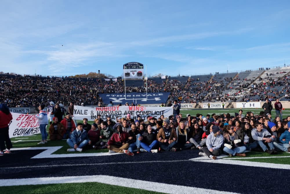 Hundreds of students and alumni take to the field in protest of climate change during Harvard-Yale rivalry football game on Saturday, Nov. 23, 2019 (Courtesy of Fossil Fuel Divest Harvard).