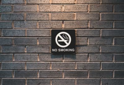 Reframing the national conversation from smokers' rights, which pitched smokers against non-smokers, to public health, which united the American people against Big Tobacco, helped drive down smoking rates. (JJ Shev/Unsplash)