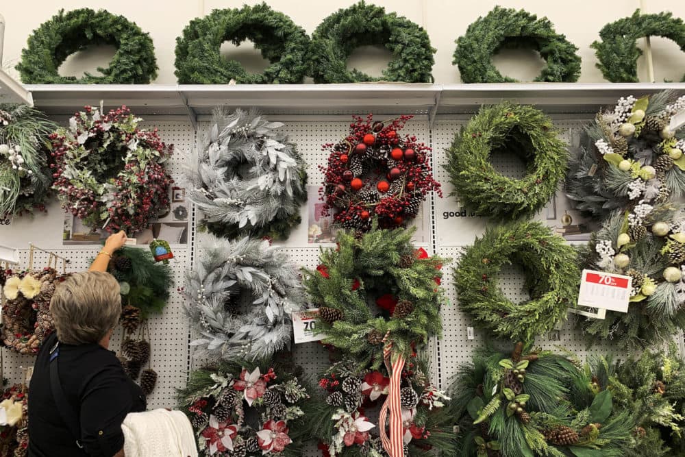 A woman looks through holiday wreathes on sale at a retail store during on Saturday, Nov. 9, 2019, in Pembroke Pines, Fla. (Brynn Anderson/AP)