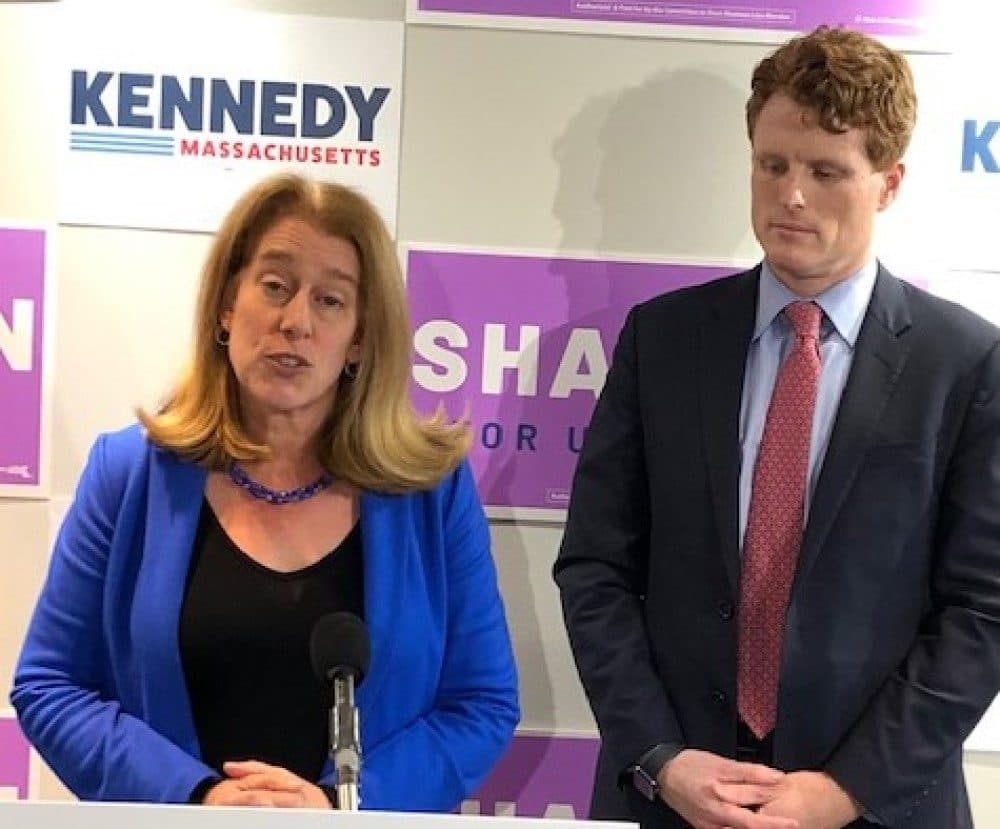 Attorney Shannon Liss-Riordan and U.S. Rep. Joseph Kennedy III, both Democratic candidates for the U.S. Senate seat currently held by Ed Markey, speak after signing the &quot;People's Pledge on Monday, Dec. 2 (Anthony Brooks/WBUR)