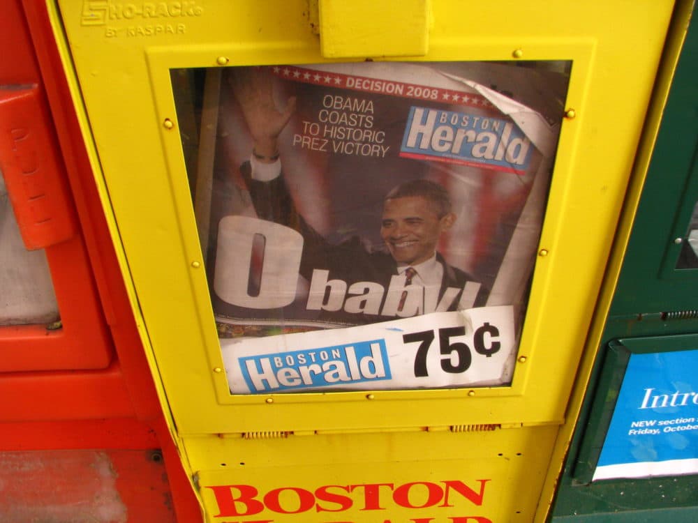 A newsstand holds Boston Herald newspapers. (sushiesque/flickr)