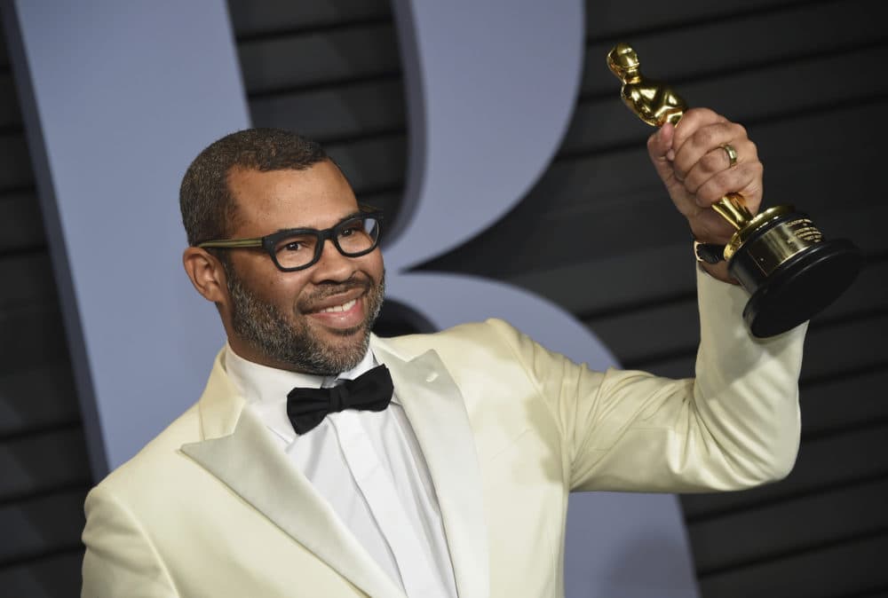 Jordan Peele, winner of the award for best original screenplay for &quot;Get Out,&quot; arrives at the Vanity Fair Oscar Party on Sunday, March 4, 2018, in Beverly Hills, Calif. (Photo by Evan Agostini/Invision/AP)