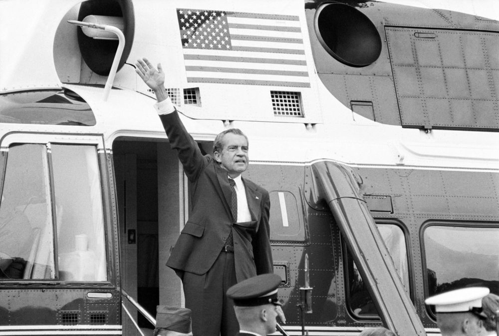 In this Aug. 9, 1974 photo, President Richard Nixon waves goodbye from the steps of his helicopter outside the White House, after he gave a farewell address to members of the White House staff. (Chick Harrity/AP)