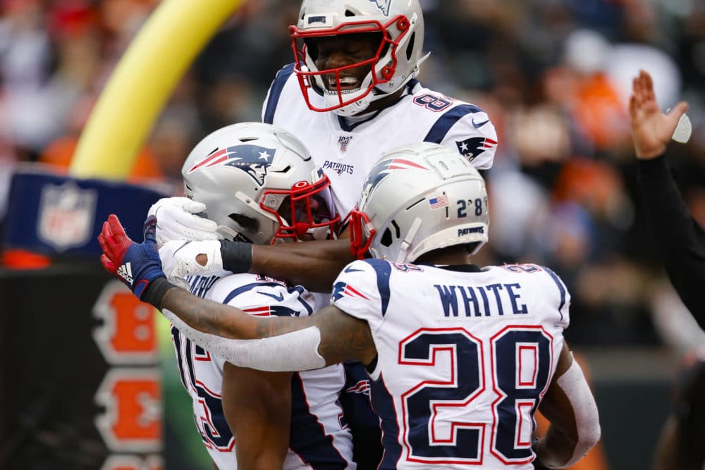 New England Patriots wide receiver N'Keal Harry, left, celebrates his touchdown in the second half of an NFL football game against the Cincinnati Bengals, Sunday, Dec. 15, 2019, in Cincinnati. (AP Photo/Gary Landers)