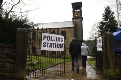 Residents arrive to vote at a polling station in Dobcross, northwest England, as Britain holds a general election on December 12, 2019. (Oli Scarff/AFP/Getty Images)