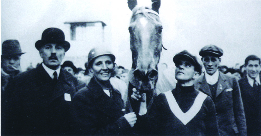 Lata Brandisová and her mare, Norma, as they're led away from the finish line of the 1937 Grand Pardubice. (Courtesy of Pospišil Archives)