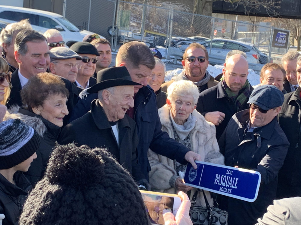 Lou Pasquale (center in brimmed hat) and his wife Terry were joined by Mayor Martin Walsh and other officials and friends during a surprise ceremony to dedicate a square in front of Boston Bowl in his name. (Daniel Sheehan/Dorchester Reporter)