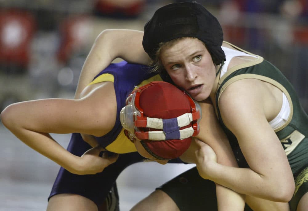 Despite the decreasing participation in most high school sports, girls wrestling has been booming. (Jim Bryant/AP)