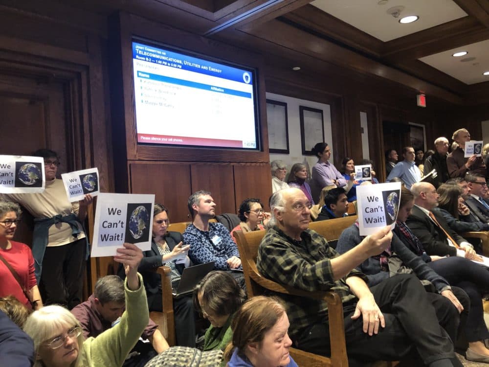 People packed a hearing on carbon pricing at the State House on Tuesday. (Bruce Gellerman/WBUR)