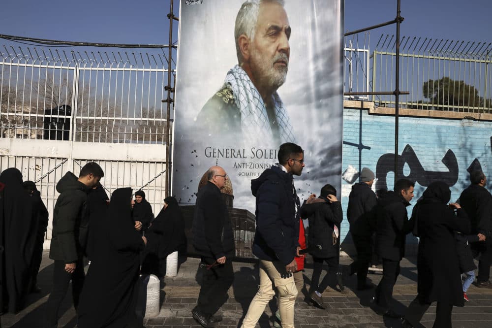 Mourners walk back from a funeral ceremony for Iranian Gen. Qassem Soleimani in front of the former U.S. Embassy, who was killed with others in Iraq by a Friday U.S. drone attack, Monday, Jan. 6, 2020. (Vahid Salemi/AP)