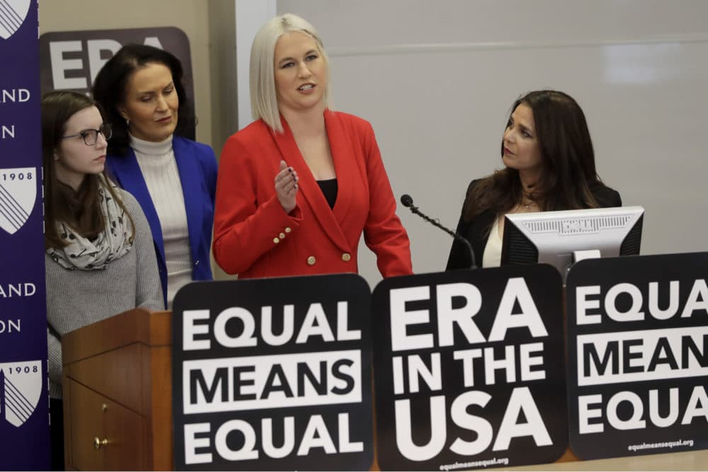 Vice President of Equal Means Equal Natalie White, center right, faces reporters as plaintiff Katherine Weitbrecht, left, legal counsel Wendy Murphy, second from left, and President of the organization Kamala Lopez, right, look on during a news conference, Tuesday, in Boston, (Steven Senne/AP)
