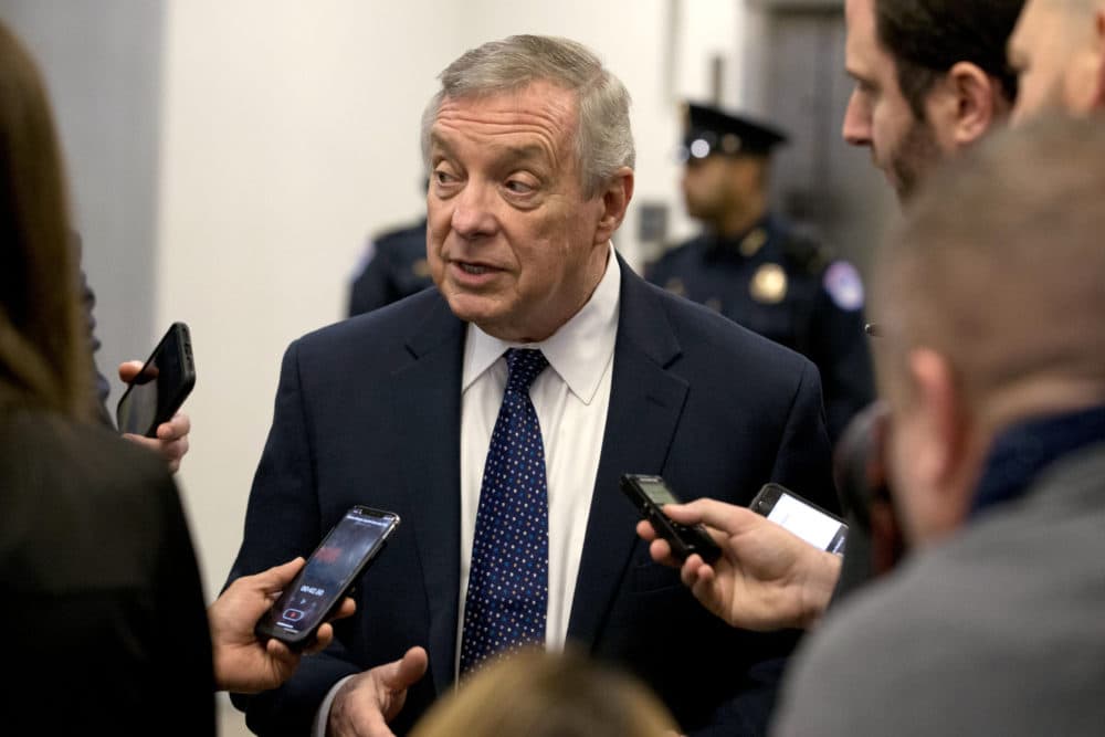 Sen. Dick Durbin talks to reporters as he walks to attend the impeachment trial of President Trump. (Jose Luis Magana/AP)