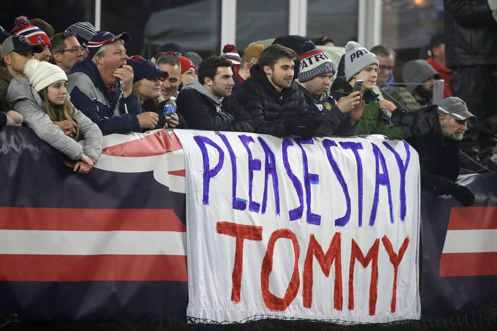 New England Patriots fans stand by a sign supporting quarterback Tom Brady in the first half of an NFL wild-card playoff football game between the Patriots and the Tennessee Titans, Saturday, Jan. 4, 2020, in Foxborough, Mass. Brady's contract expires at the end of the season. (Elise Amendola/AP Photo)