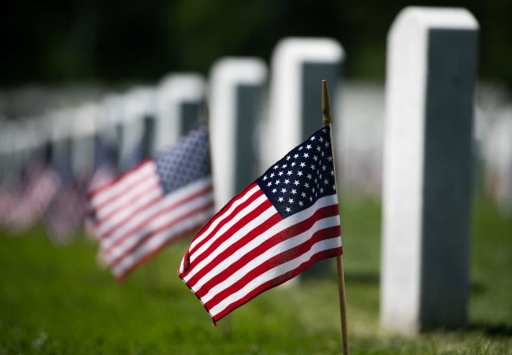 U,S. flags are planted at grave sites at Arlington National Cemetery in Arlington, Virginia, ahead of the Memorial Day weekend in 2019. (Saul Loeb/AFP/Getty Images)