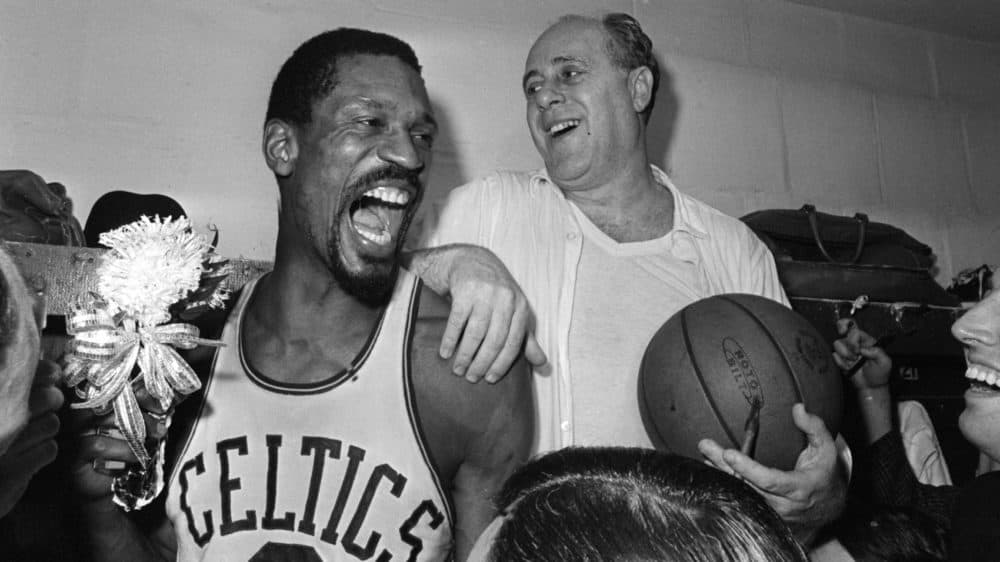 Bill Russell, left, and Celtics coach Red Auerbach celebrate the team's victory over the L.A. Lakers for the 1966 NBA title. (AP)