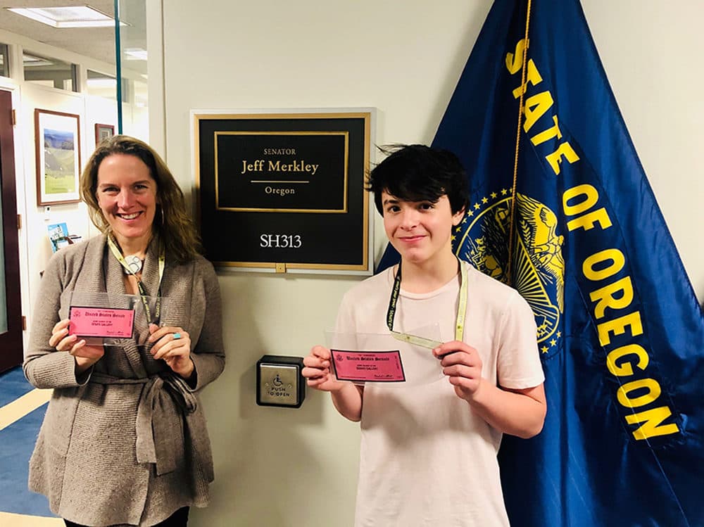 Mary Finn and Aidan Hollinger-Miles with their tickets to watch the impeachment trial. (Courtesy)