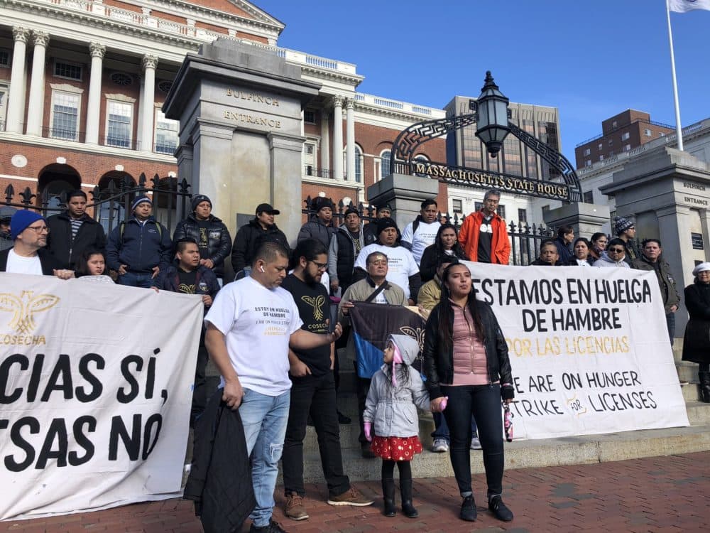Activists gather outside the Massachusetts State House on Monday to launch a hunger strike in support of a bill that would allow driver's licenses for undocumented immigrants. (Shannon Dooling/WBUR)