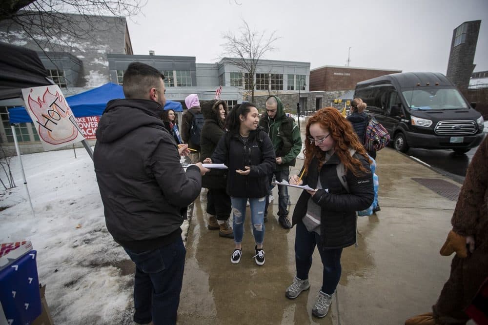 University of New Hampshire students register to vote on campus and then take a shuttle over to Oyster River High School to vote. (Jesse Costa/WBUR)
