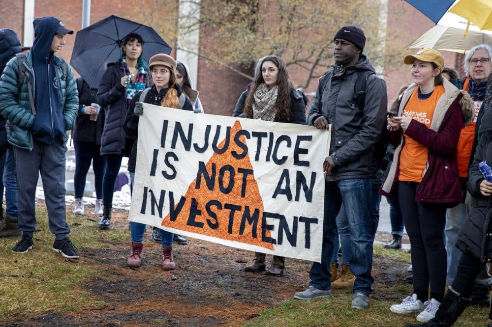 Protesters gathered at the Usdan Student Center at Brandeis University and called on the school to divest from fossil fuels. (Robin Lubbock/WBUR)