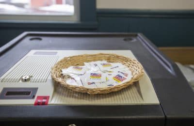 Stickers on top of a voting machine at a polling place in Concord, New Hampshire.  (Joe Difazio for WBUR)