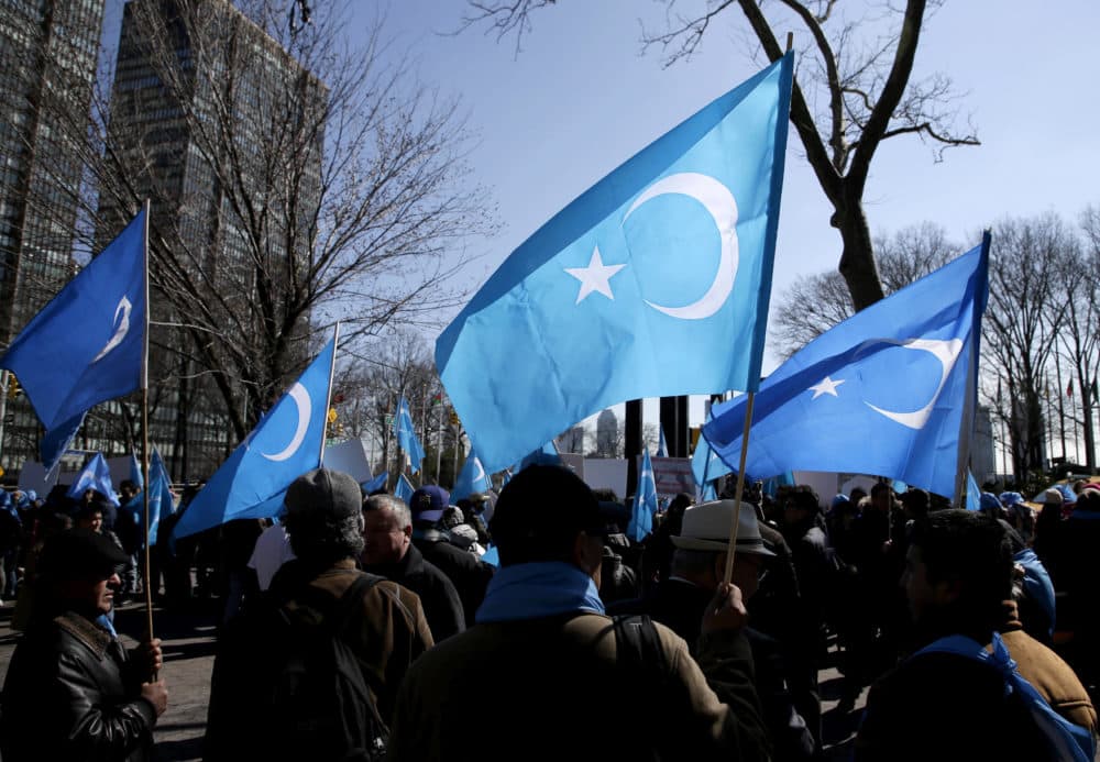 Uighurs and their supporters rally across the street from United Nations headquarters in New York on March 15, 2018 to protest a sweeping Chinese surveillance and security campaign that has sent thousands of their people into detention and political indoctrination centers. (Seth Wenig/AP)