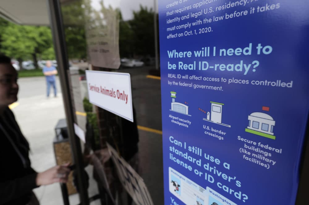A sign provides information about the requirements of Real ID. (Ted S. Warren/AP)