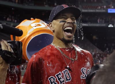 Boston Red Sox's Mookie Betts is doused after their victory over the New York Yankees in a baseball game at Fenway Park, Friday, July 26, 2019, in Boston. (Elise Amendola/AP)
