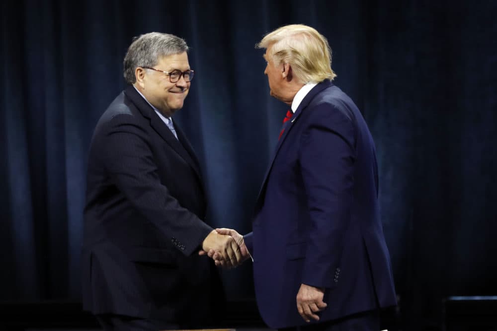 President Donald Trump shakes hands with Attorney General William Barr before Trump signed an executive order creating a commission to study law enforcement and justice at the International Association of Chiefs of Police Convention Monday, Oct. 28, 2019, in Chicago. (Charles Rex Arbogast/AP)