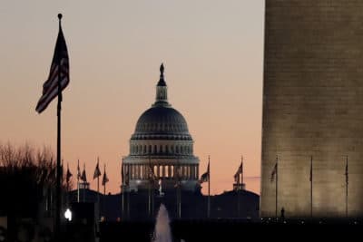 The U.S. Capitol building, center, and part of the Washington Monument, right, on Wednesday, Dec. 18, 2019, on Capitol Hill in Washington. (Julio Cortez/AP)