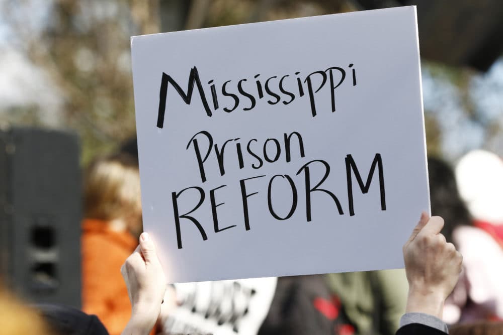 Several attendees waved handmade posters calling for help for the inmates during a mass rally in front of the Mississippi Capitol in Jackson, Miss., Friday, Jan. 24, 2020, protesting conditions in prisons where inmates have been killed in violent clashes in recent weeks. (Rogelio V. Solis/AP)