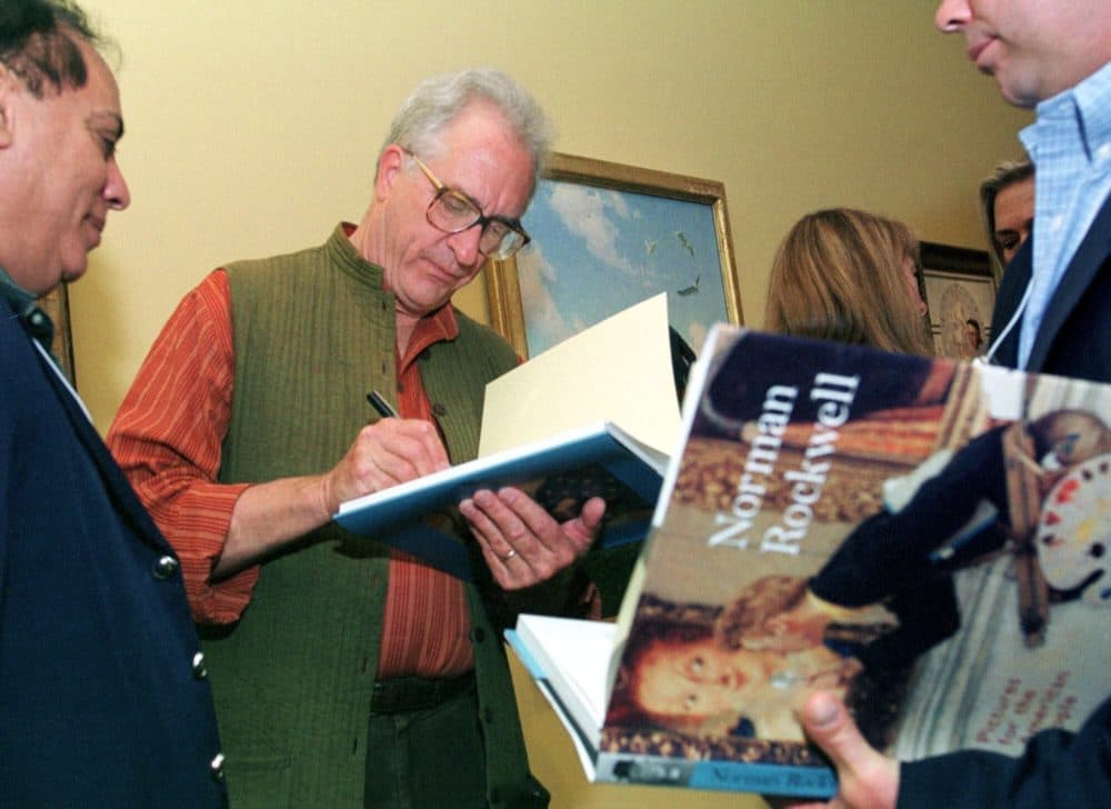 In this June 7, 2001 file photo, Peter Rockwell autographs a book at The Rockwell Museum in Stockbridge, Mass. (AP Photo/Nancy Palmieri, File)