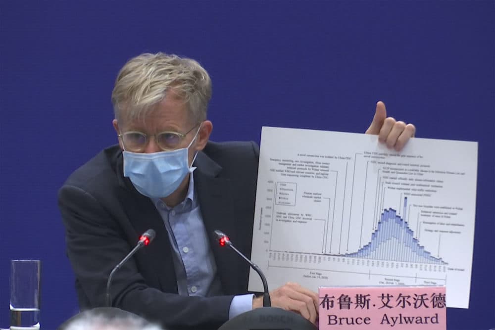 Bruce Aylward, an assistant director-general of the World Health Organization speaks with a chart during a press conference in Beijing on Monday, Feb. 24, 2020. Aylward said in Beijing on Monday that China's actions had probably prevented tens of thousands and possibly hundreds of thousands of cases of ther COVID-19 virus. (Sam McNeil/AP)
