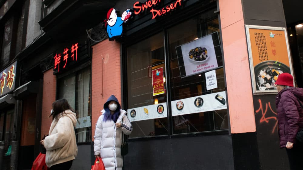 On a recent afternoon in Chinatown, it was not uncommon to see people wearing face masks. (Adrian Ma/WBUR)