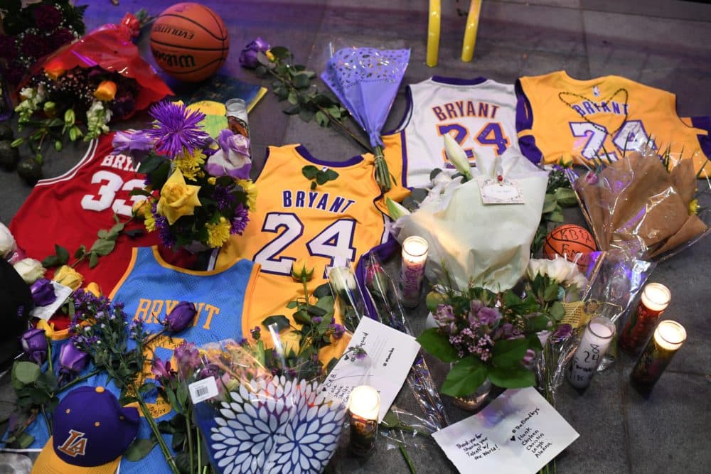 Jerseys, flowers and candles are placed at a makeshift memorial as fans mourn the death of NBA legend Kobe Bryant. (Robyn Beck/AFP via Getty Images)