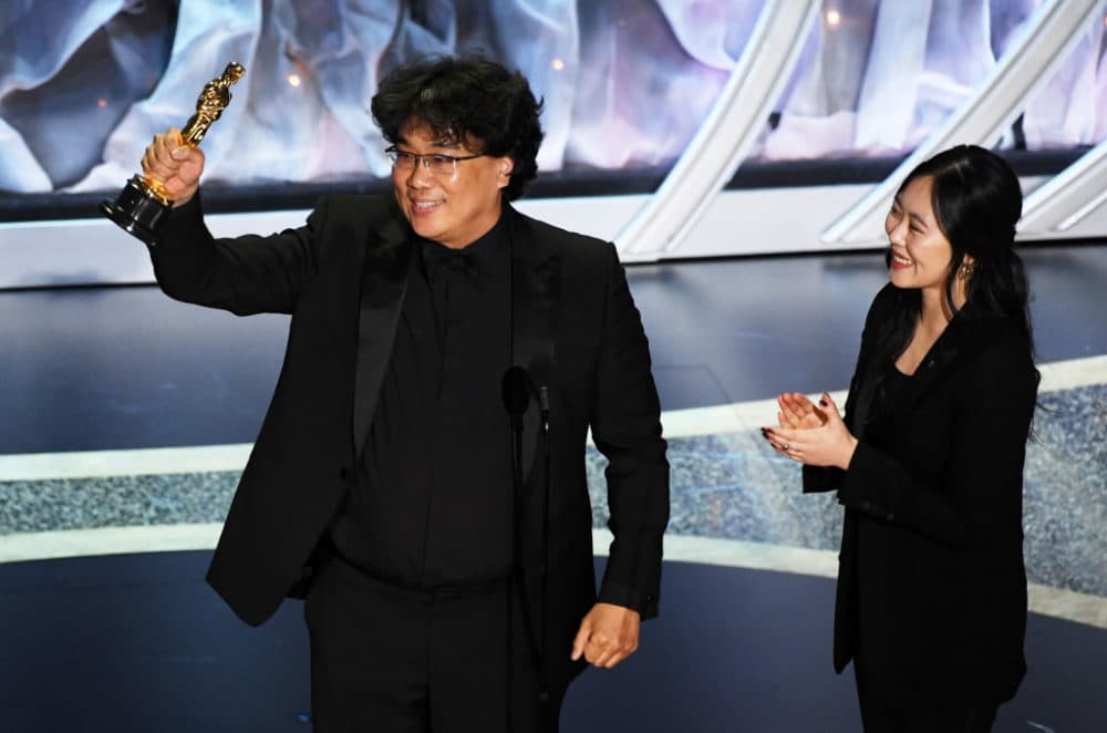 Bong Joon-ho accepts the International Feature Film award for &quot;Parasite&quot; with interpreter Sharon Choi onstage during the 92nd Annual Academy Awards. (Kevin Winter/Getty Images)