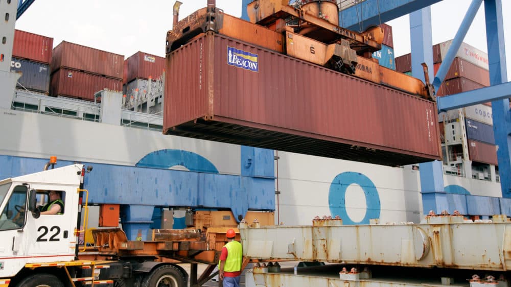 A container is loaded onto a ship from China at Massport's Conley Terminal in the port of Boston. (Stephan Savoia/AP)