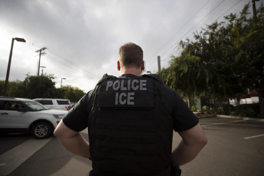 In this July 8, 2019, file photo, a U.S. Immigration and Customs Enforcement (ICE) officer looks on during an operation in Escondido, Calif. (Gregory Bull/AP)