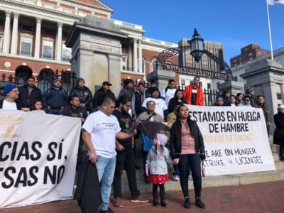 Activists with Movimiento Cosecha rallied and began a hunger strike Monday, Feb. 3, 2020. They’re protesting what they say is the Legislature’s inaction on the Work and Family Mobility Act, which would grant access to driver's licenses for undocumented immigrants. (Shannon Dooling/WBUR)