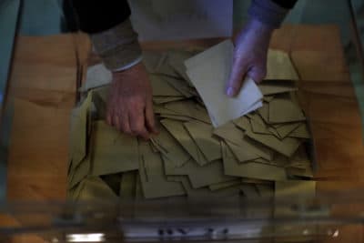 Ballots are counted by an election official for the 2017 presidential election at a polling station in Paris, The election was seen as a test for the spread of populism around the world. (Emilio Morenatti/AP)
