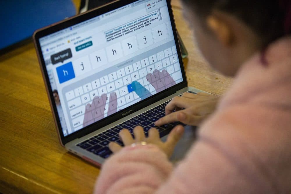 Maddy Baldwin uses software on her laptop computer to learn how to type in this 2019 file photo at Perkins School for the Blind. (Jesse Costa/WBUR)