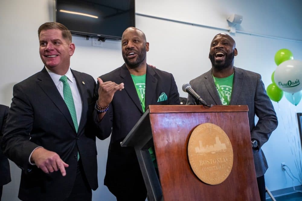 Boston Mayor Marty Walsh, and Pure Oasis co-owners Kobie Evans and Kevin Hart celebrate and announce the opening of the first marijuana dispensary located in Boston. (Jesse Costa/WBUR)
